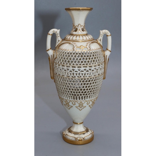 1185 - George Owen for Royal Worcester, a reticulated twin handled pedestal vase, 1911 date mark, ovoid for...