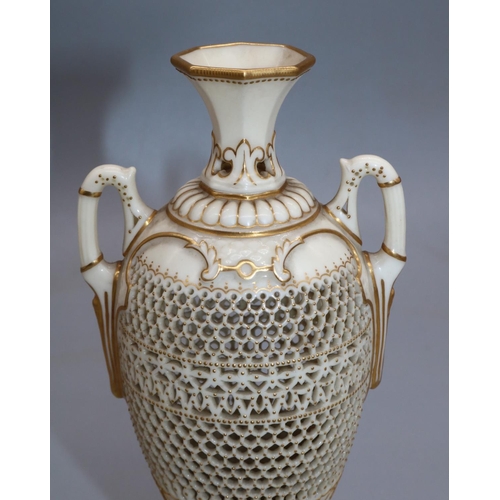 1185 - George Owen for Royal Worcester, a reticulated twin handled pedestal vase, 1911 date mark, ovoid for... 