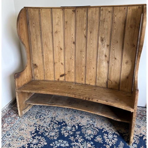 1418 - 19th century pine Tavern settle with curved high boarded back, plank seat with shaped arms, W140cm D... 