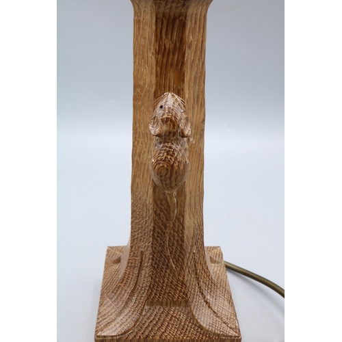 1388 - Robert Mouseman Thompson of Kilburn - an oak table lamp octagonal column on a square base, carved wi... 