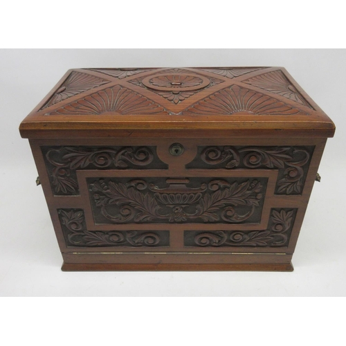 1089 - Victorian walnut tabletop stationery cabinet carved with urn and stylised foliage, opening to reveal... 