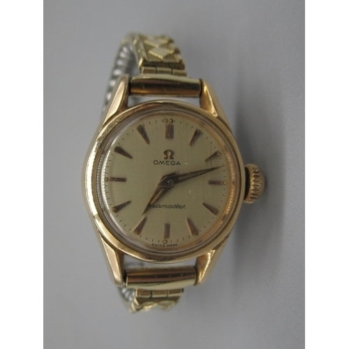 1025 - Ladies Omega Seamaster gold plated wristwatch, signed champagne dial, applied logo and baton indices... 