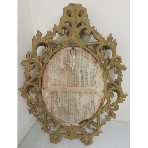 1452 - Florentine style gilt wall mirror, oval plate with beaded and acanthus scroll frame, H70cm