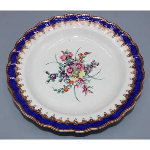 1201 - Worcester circular plate, painted to centre with a spray of wild flowers within a blue and gilt shap... 