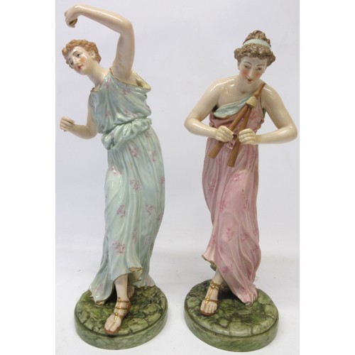 1220 - Pair of Royal Worcester models of Female musician figures, decorated in colours on naturalistic circ... 