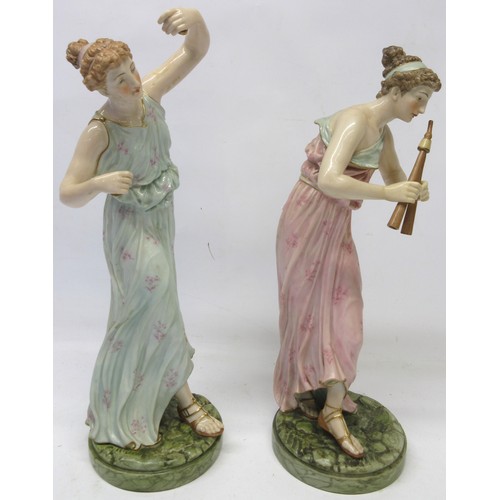 1220 - Pair of Royal Worcester models of Female musician figures, decorated in colours on naturalistic circ... 