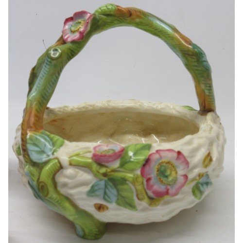 1218 - Royal Worcester posy bowl modelled as a birds nest with branchwork handle and decorated with coloure... 