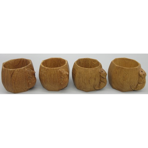 1382 - Robert Mouseman Thompson of Kilburn - a set of four octagonal napkin rings, carved with signature mo... 