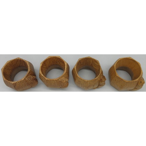 1382 - Robert Mouseman Thompson of Kilburn - a set of four octagonal napkin rings, carved with signature mo... 