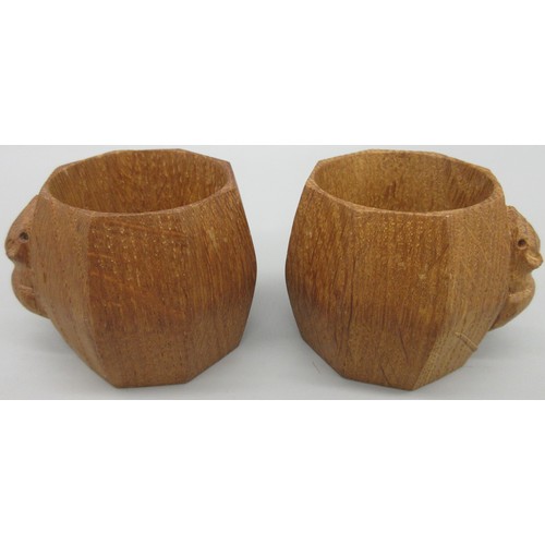 1397 - Robert Mouseman Thompson of Kilburn - a pair of octagonal napkin rings, carved with signature mouse ... 