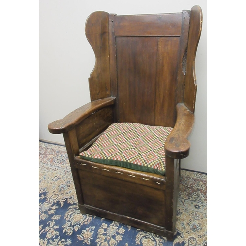 1411 - Early 19th century fruitwood and elm Lambing chair, paneled wing back with shaped arms, rope strung ... 