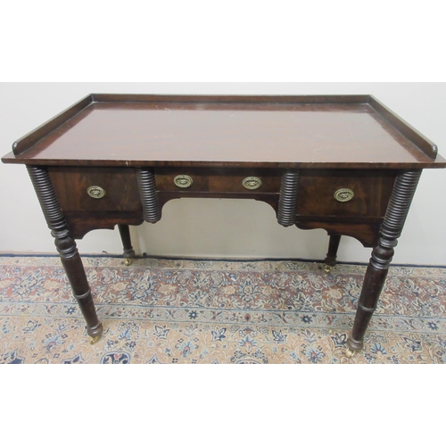 1421 - 19th century mahogany kneehole dressing table, galleried top above two deep and one shallow drawers ... 