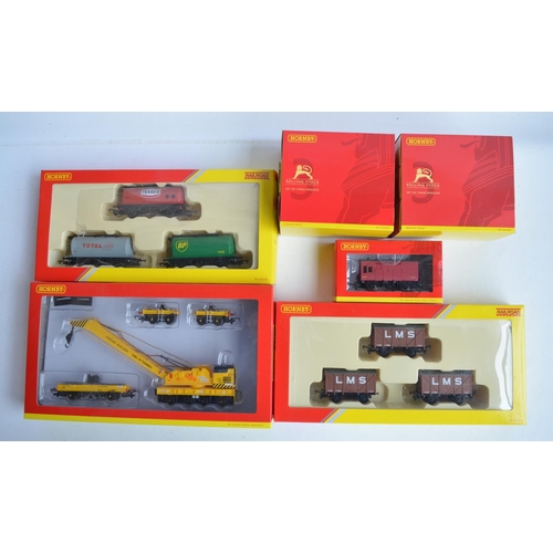 1143 - Collection of boxed OO gauge goods and service wagons from Hornby to include R6897 75 ton operating ... 