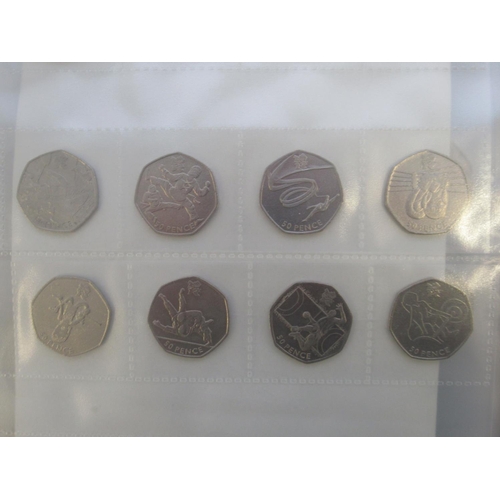 772 - Mixed collection of British/International coins and banknotes to inc. 82 commemorative 50ps, 15 £1s,... 