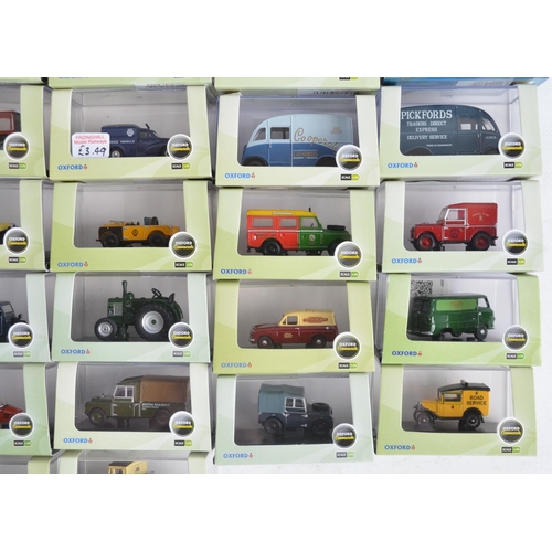 1181 - Fifty boxed 1/76 scale (OO gauge) vehicle models from Oxford Diecast's Commercials and Automobile Co... 