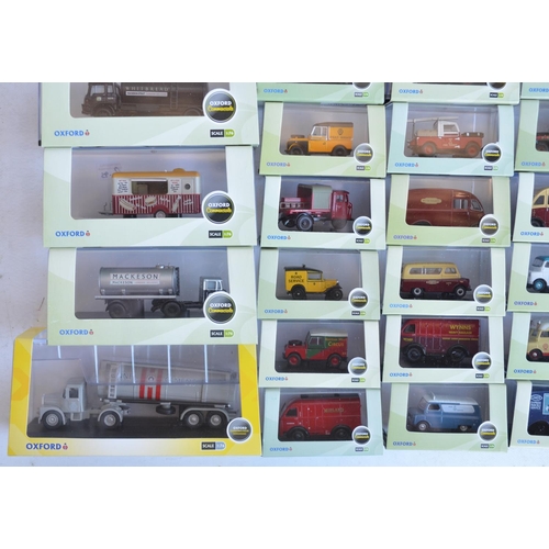 1182 - Fifty boxed 1/76 scale (OO gauge) vehicle models from Oxford Diecast's Commercials, Construction and... 