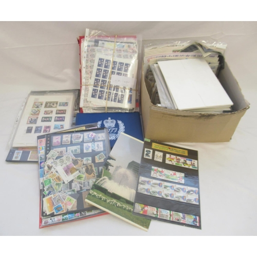 838 - Large collection of stamps and FDCs, loose, in envelopes, in stock pages and in album (qty.)