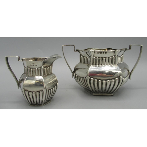 105 - Victorian silver sugar bowl in hexagonal form, twin handled, part lobed body, 1898, and a matching m... 