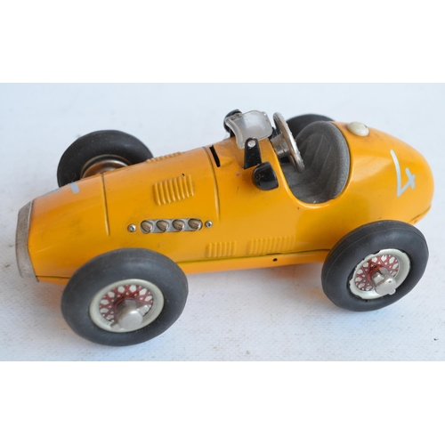 1207 - Vintage Schuco 1070 metal Grand Prix Racer (made in US zone, Germany) in good working order with wor... 