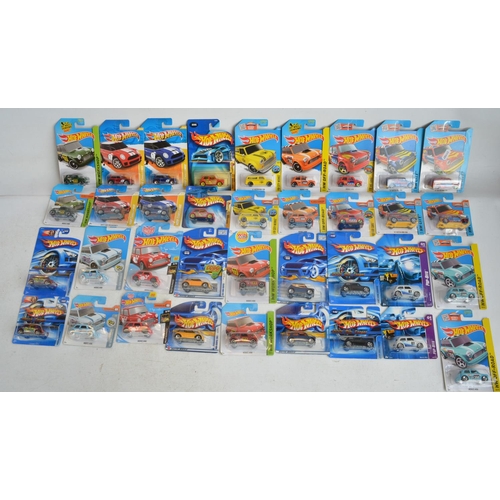 1229 - Thirty six factory sealed/unopened Hot Wheels Morris Mini diecast models with 18 different styles of... 