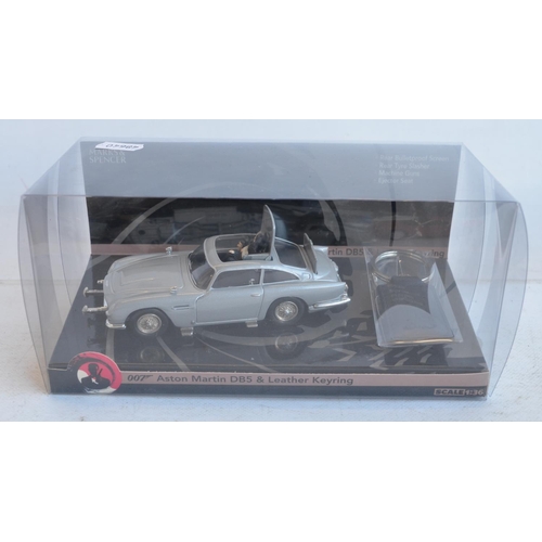 1232 - James Bond collection to include magazines and magazine syndicated diecast models, 3x IMC playsets (... 