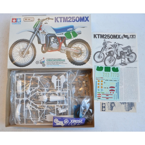 1238 - Collection of car and motorbike model kits to include 1/24 scale Tamiya Peugeot 405T16GR 1990 Paris-... 