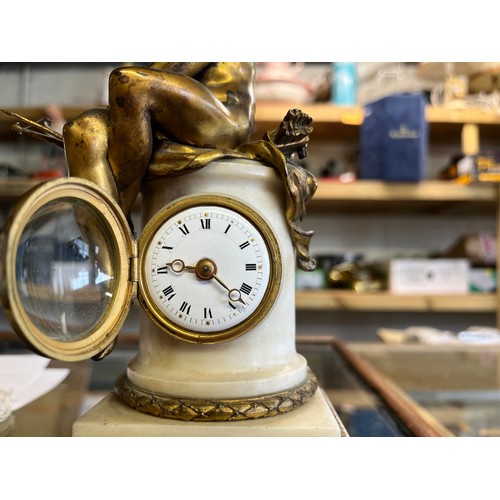 1232 - 19th Century French gilt bronze and white marble figural timepiece, circular pillar mounted with a s... 