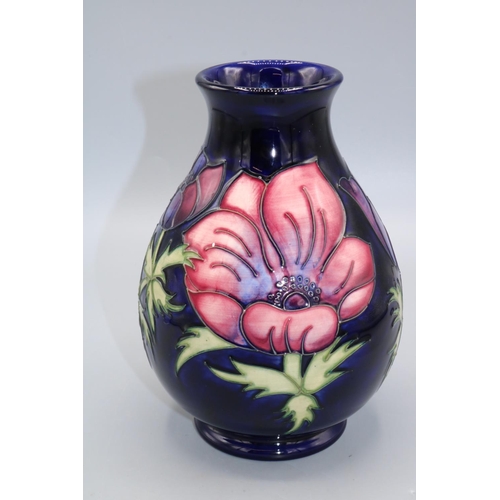 710 - Moorcroft Pottery, Anemone pattern baluster vase, red and purple flowers on dark blue ground, H19cm