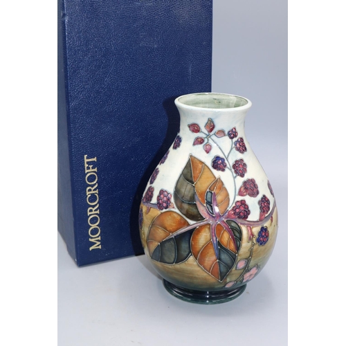 704 - Moorcroft Pottery: Bramble pattern baluster vase, H19.5cm, with box