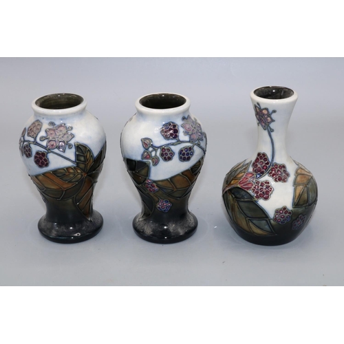 711 - Moorcroft Pottery, three Bramble pattern small vases, max. H10.5cm