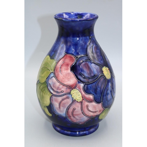 706 - Moorcroft Pottery, Anemone pattern vase, purple and red flowers on blue wash ground, H19cm