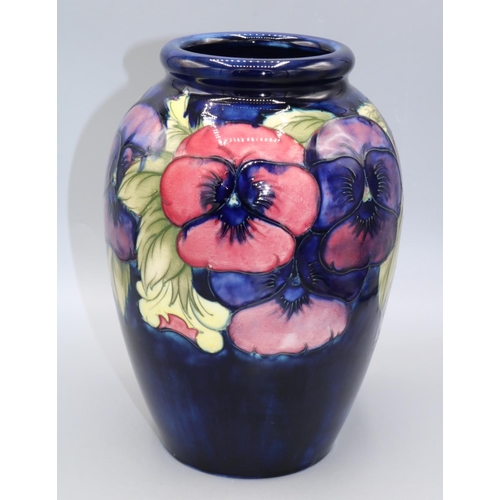 716 - Moorcroft Pottery, large Pansy pattern ovoid form vase, red and purple flowers on dark blue ground, ... 