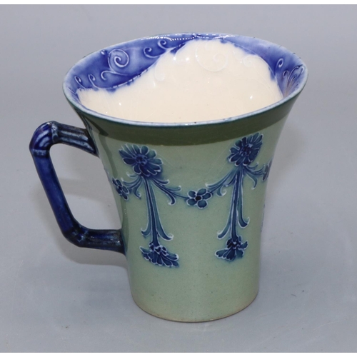 727 - Macintyre Moorcroft Florian Ware cup, H7cm, fault/restoration to rim