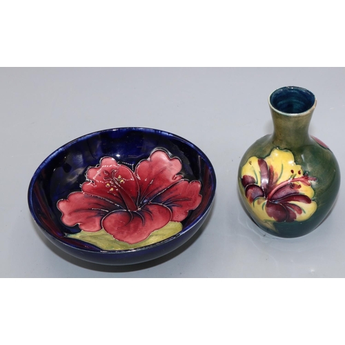 728 - Moorcroft Pottery,  small Hibiscus pattern vase with graduated green ground, H9.5cm, and a blue grou... 