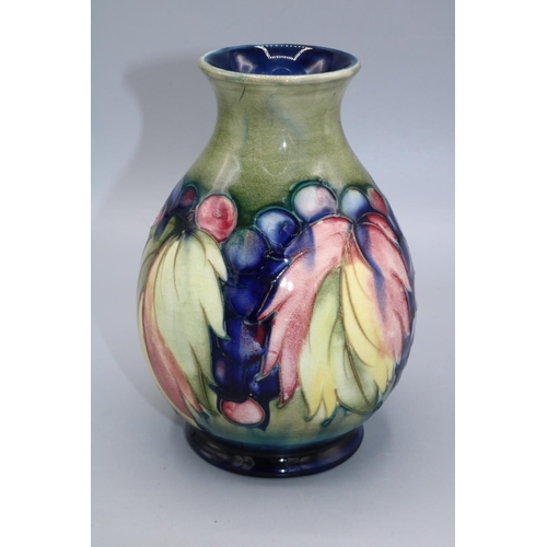 726 - Moorcroft Pottery, Leaves and Fruit design vase, green to blue graduated ground, H16cm, repaired foo... 