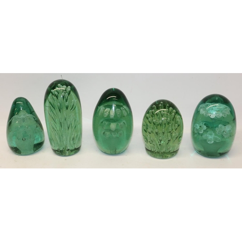 270 - Collection of Victorian green glass dumps, comprising three with internal flowers and two with spray... 