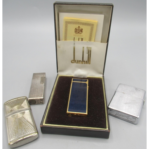 600 - Dunhill Rollagas gold plated butane cigarette lighter with dark blue panels, base stamped with origi... 