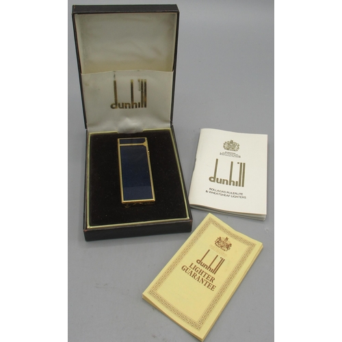 600 - Dunhill Rollagas gold plated butane cigarette lighter with dark blue panels, base stamped with origi... 