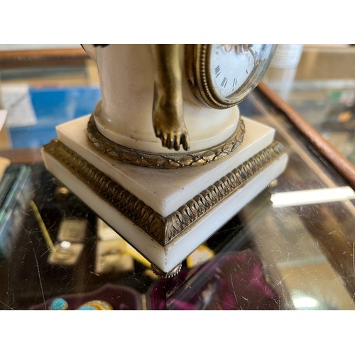 638 - 19th Century French gilt bronze and white marble figural timepiece, circular pillar mounted with a s... 