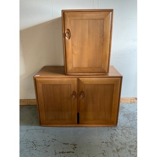 668 - Ercol light elm two door cabinet and a similar single door cabinet, W91cm D43cm H61cm max (2)