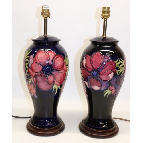 695 - Moorcroft Pottery, pair of Anemone pattern inverted baluster table lamps, red and purple flowers on ... 