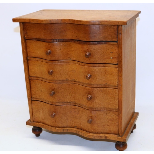 294 - Oak serpentine front apprentice piece chest of drawers, turned legs and handles, H36.5cm W30.5cm D16... 