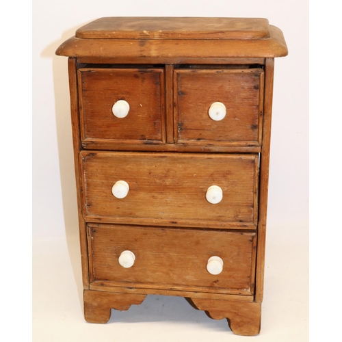 295 - Pine apprentice piece chest of two short over two long drawers, white ceramic handles, W23cm H38cm D... 