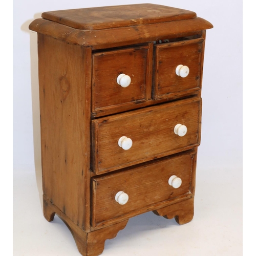 295 - Pine apprentice piece chest of two short over two long drawers, white ceramic handles, W23cm H38cm D... 