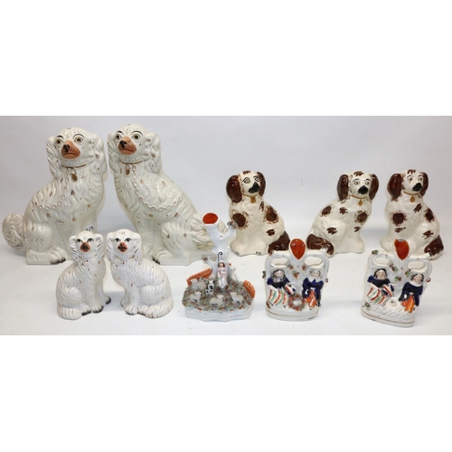 318 - Pair of large white Staffordshire spaniels, H31cm, and other similar figures and spill vases (10)