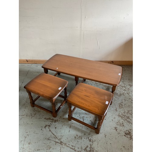 675 - Pair of Ercol dark elm joint type stools, W44cm D36cm H38cm (2) and a table