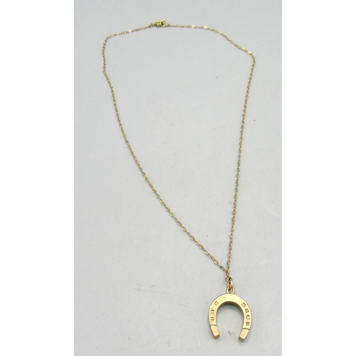 10 - 9ct yellow gold horseshoe pendant on 9ct gold chain, stamped 375 and 9ct, 3.77g