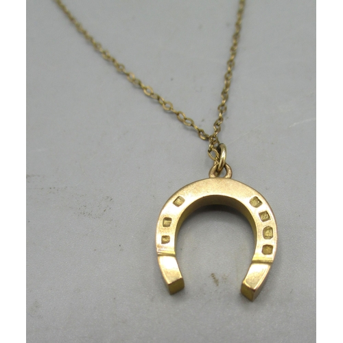 10 - 9ct yellow gold horseshoe pendant on 9ct gold chain, stamped 375 and 9ct, 3.77g