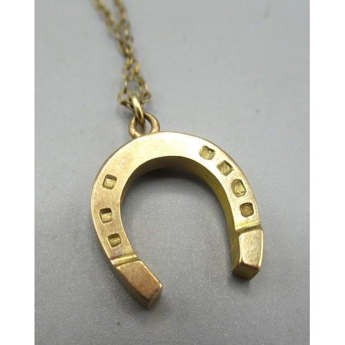 10 - 9ct yellow gold horseshoe pendant on 9ct gold chain, stamped 375 and 9ct, 3.77g