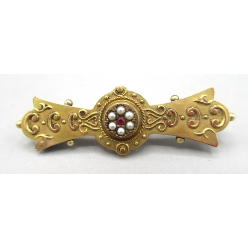 13 - Edwardian 9ct yellow gold bar brooch with panel back, the front set with ruby and seed pearl cluster... 